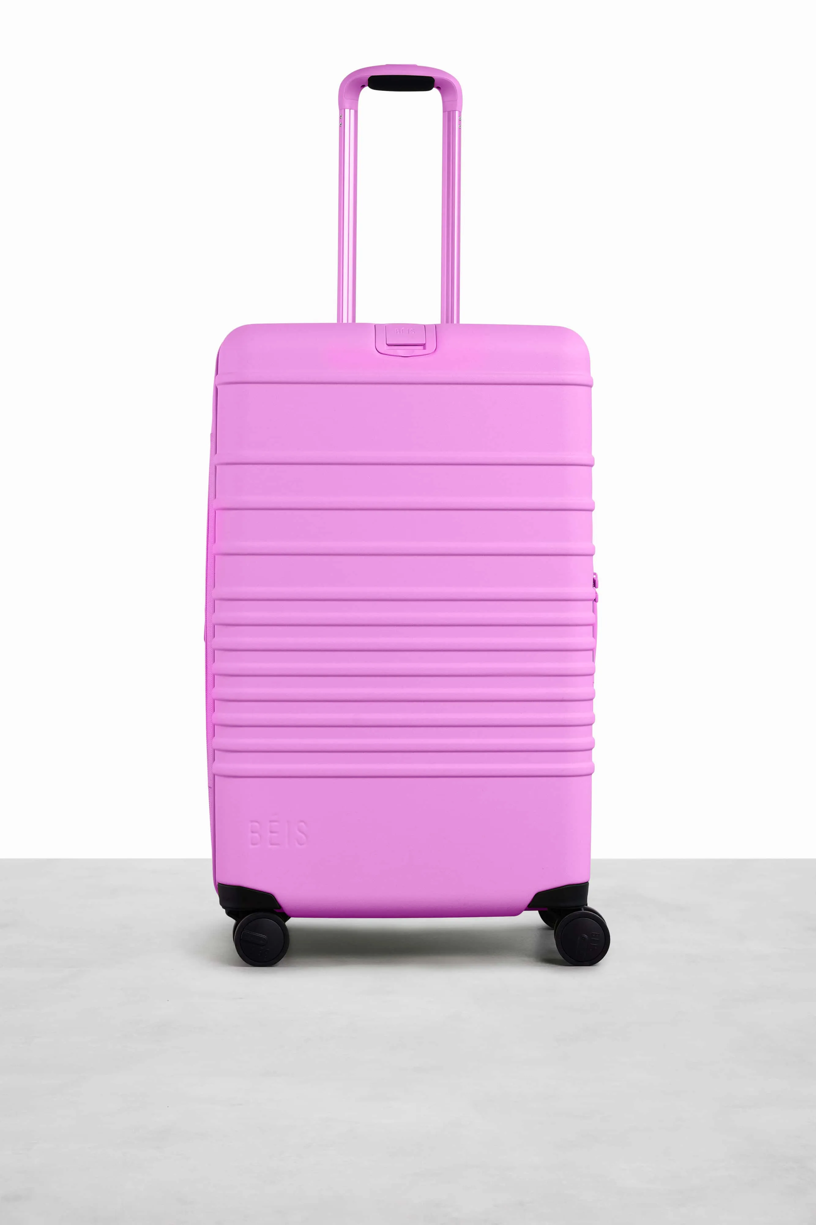 The Medium Check-In Roller in Berry